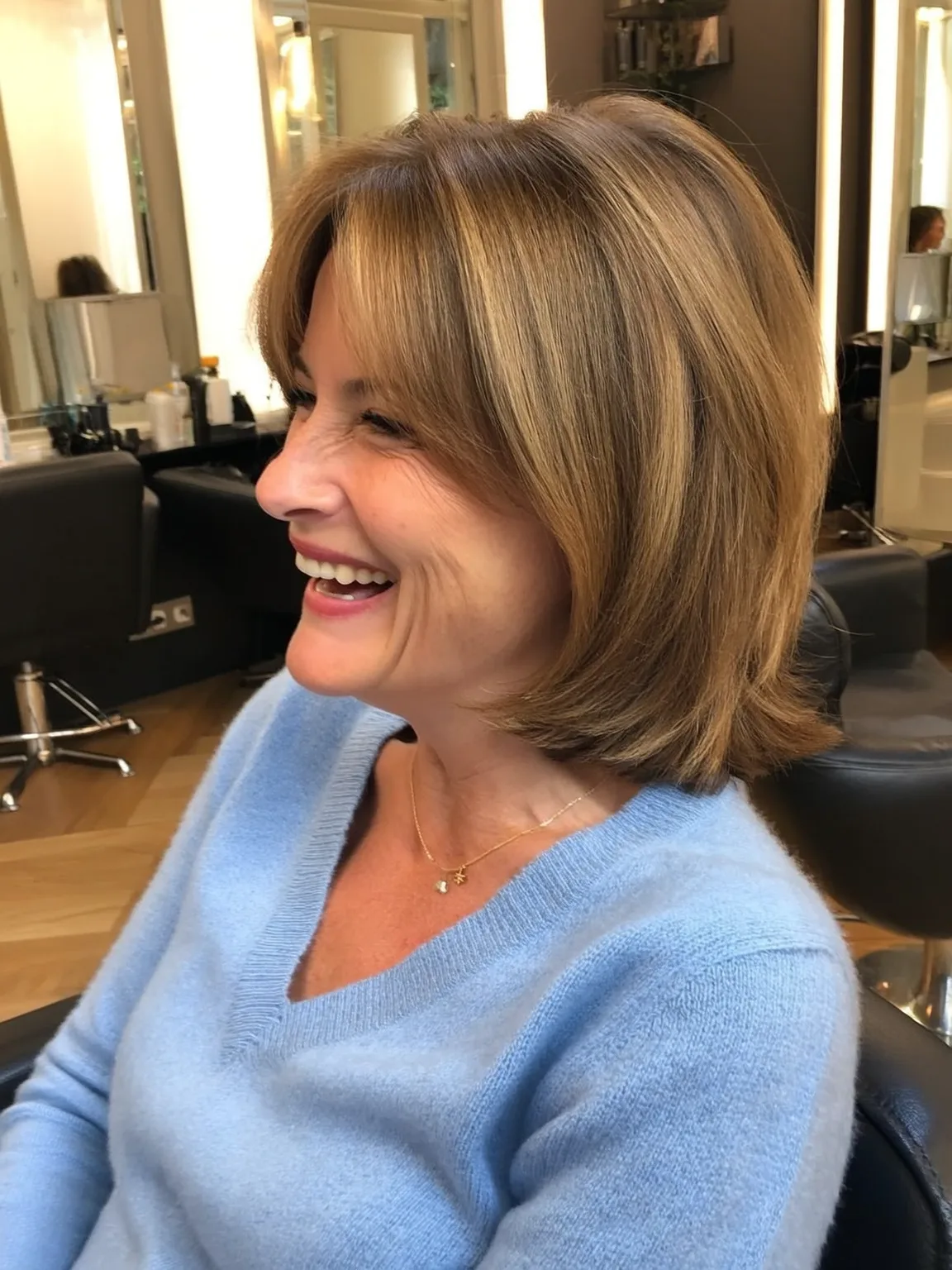 Shoulder-Length Layered Bob with Caramel Blonde Highlights